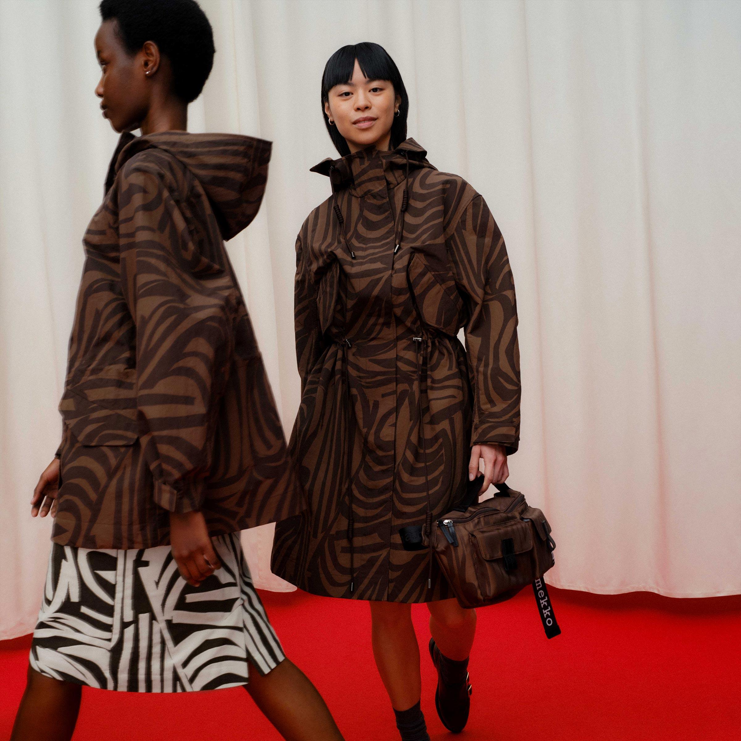 Models wearing coats in Jokuraita pattern.
