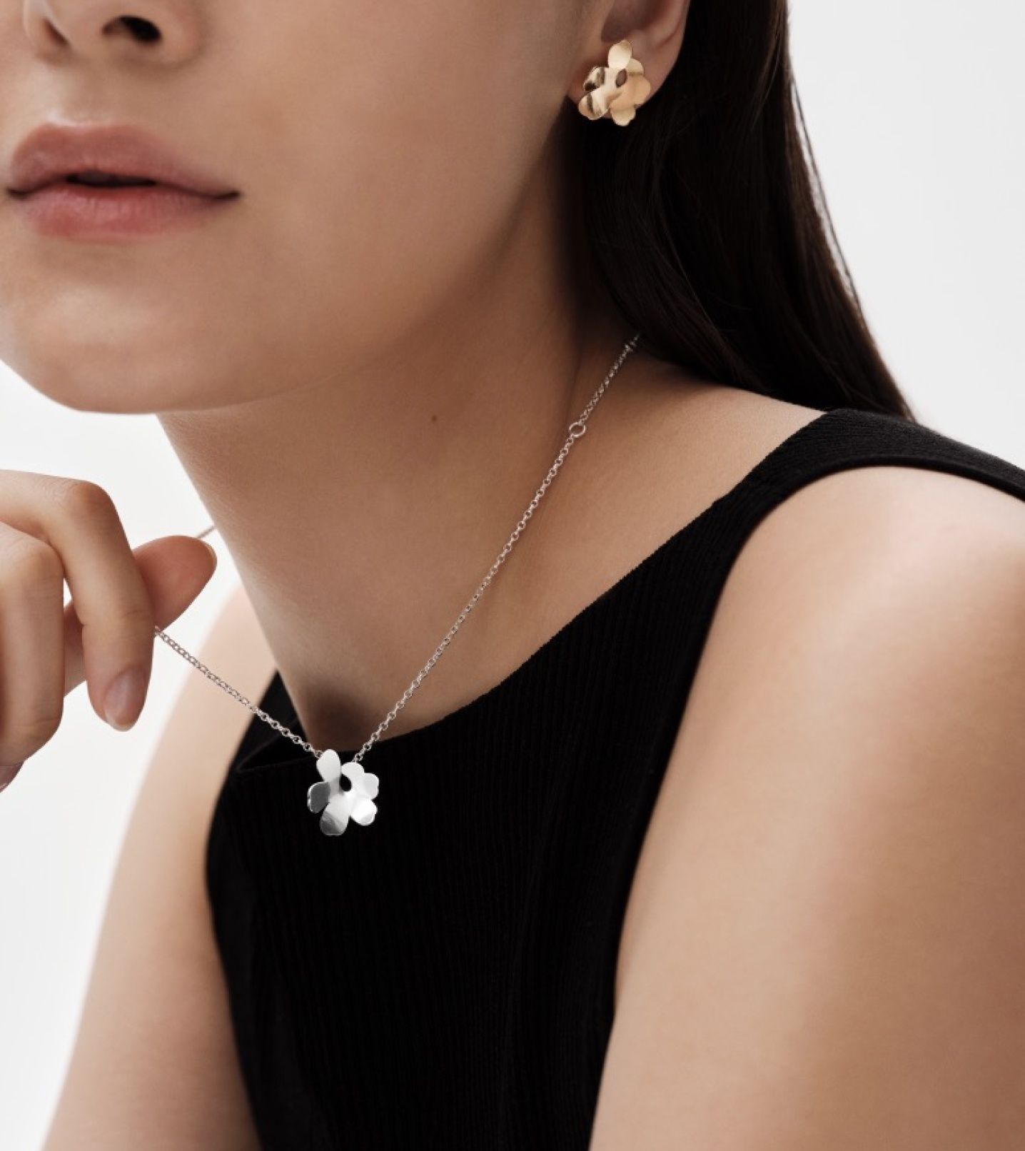 Model wearing Kalevala x Marimekko necklace and earring.