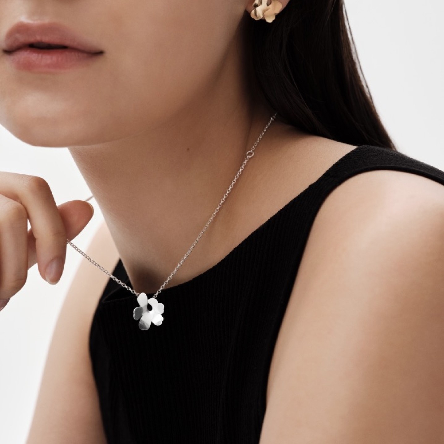 Model wearing Kalevala x Marimekko necklace and earring.