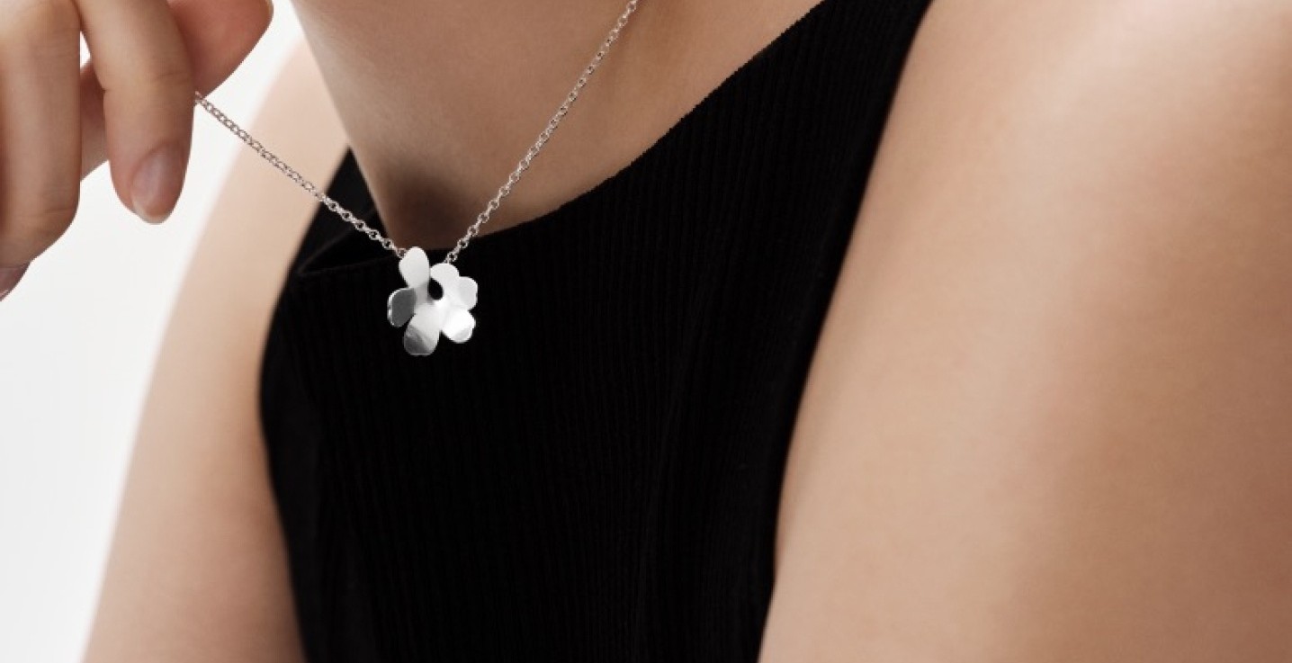 Model wearing Kalevala x Marimekko necklace and earring.