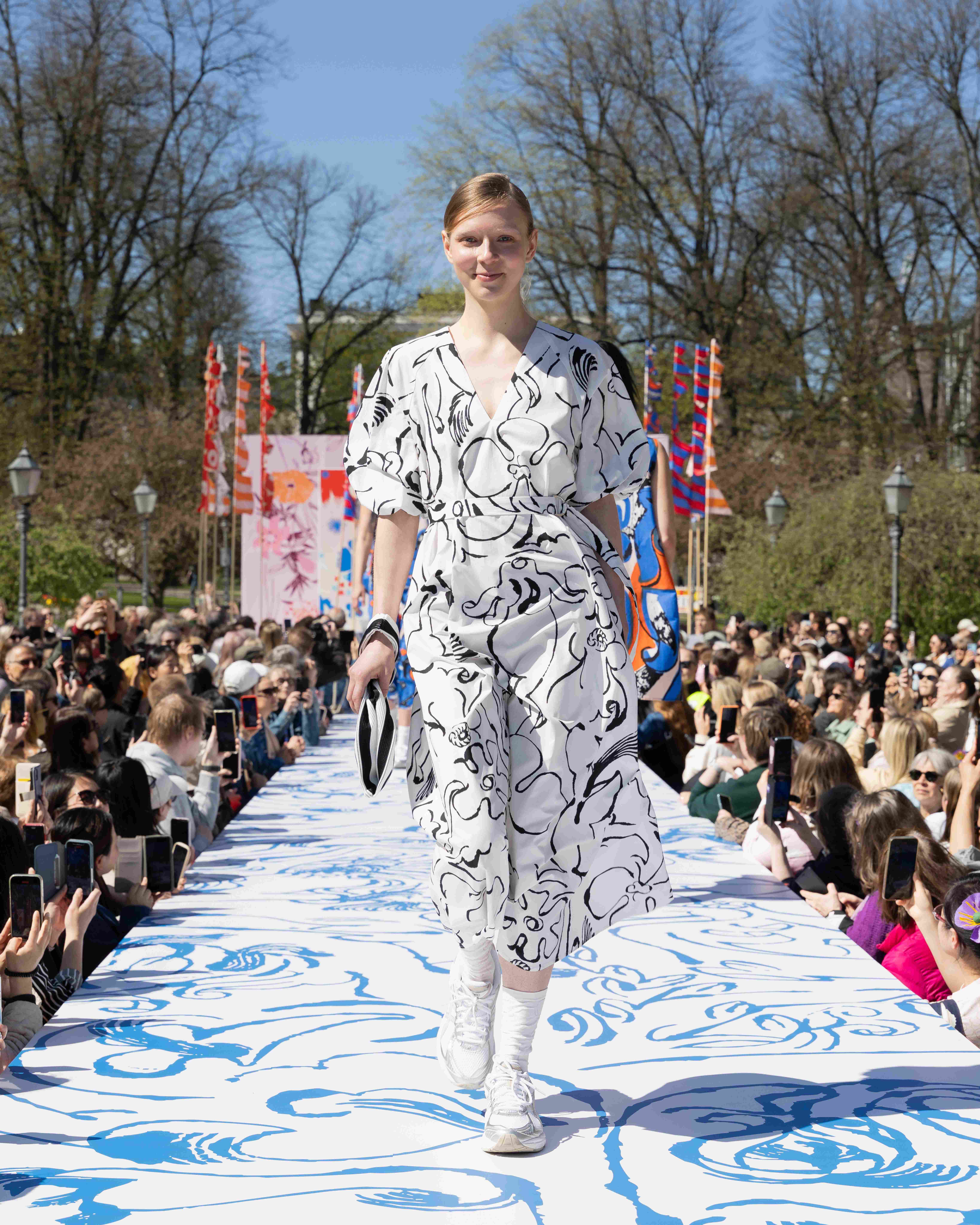 Model wearing Kimppu dress in Baluns print.