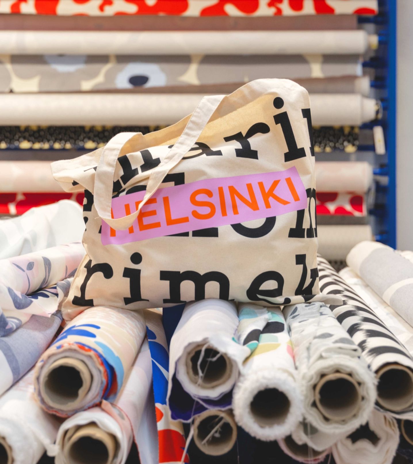 Logo tote that says Helsinki in orange and pink.