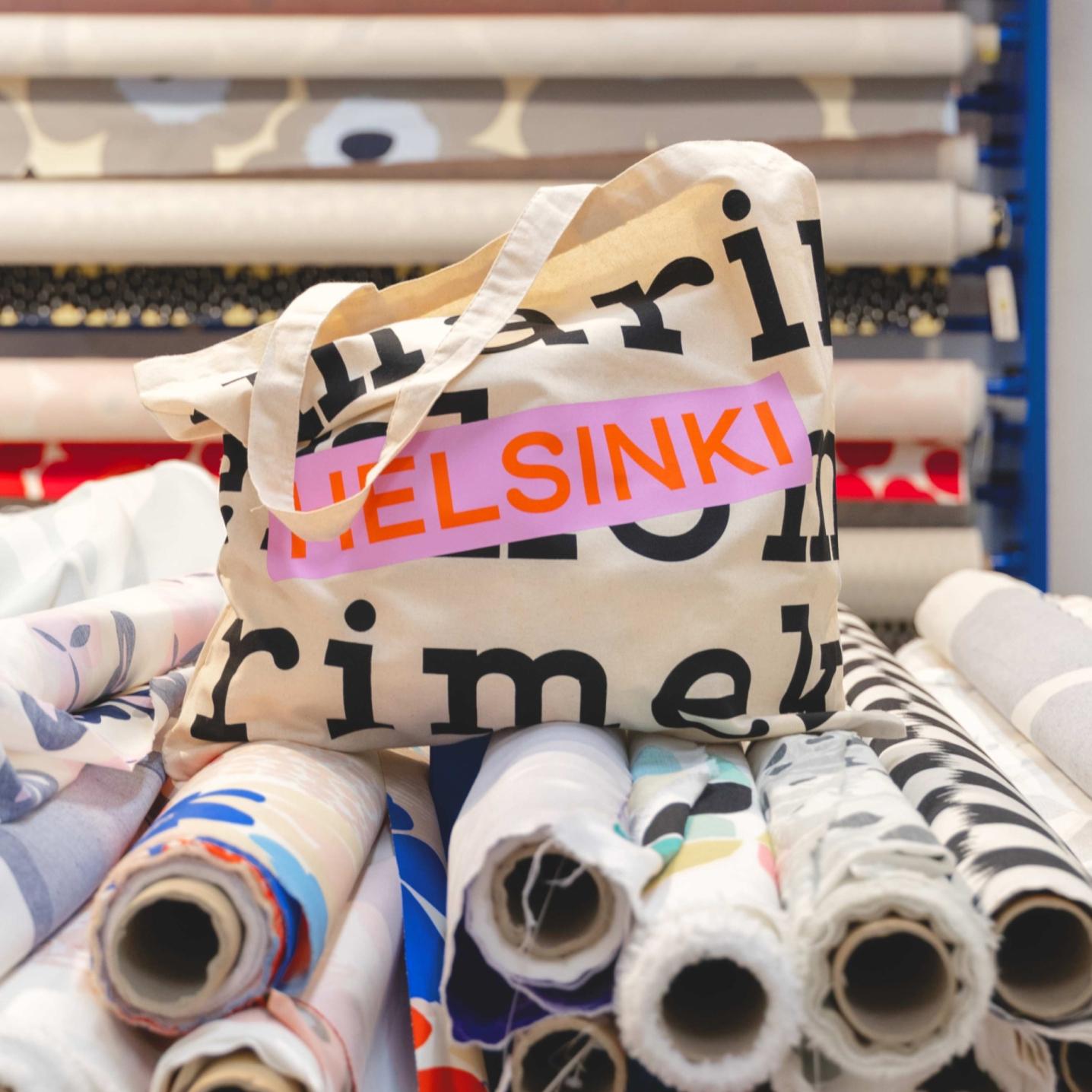 Logo tote that says Helsinki in orange and pink.