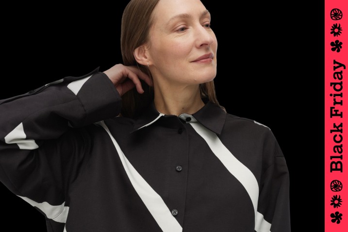 Woman wearing black and white stripe shirts. Image with Black Friday stripe down the right hand side of the frame