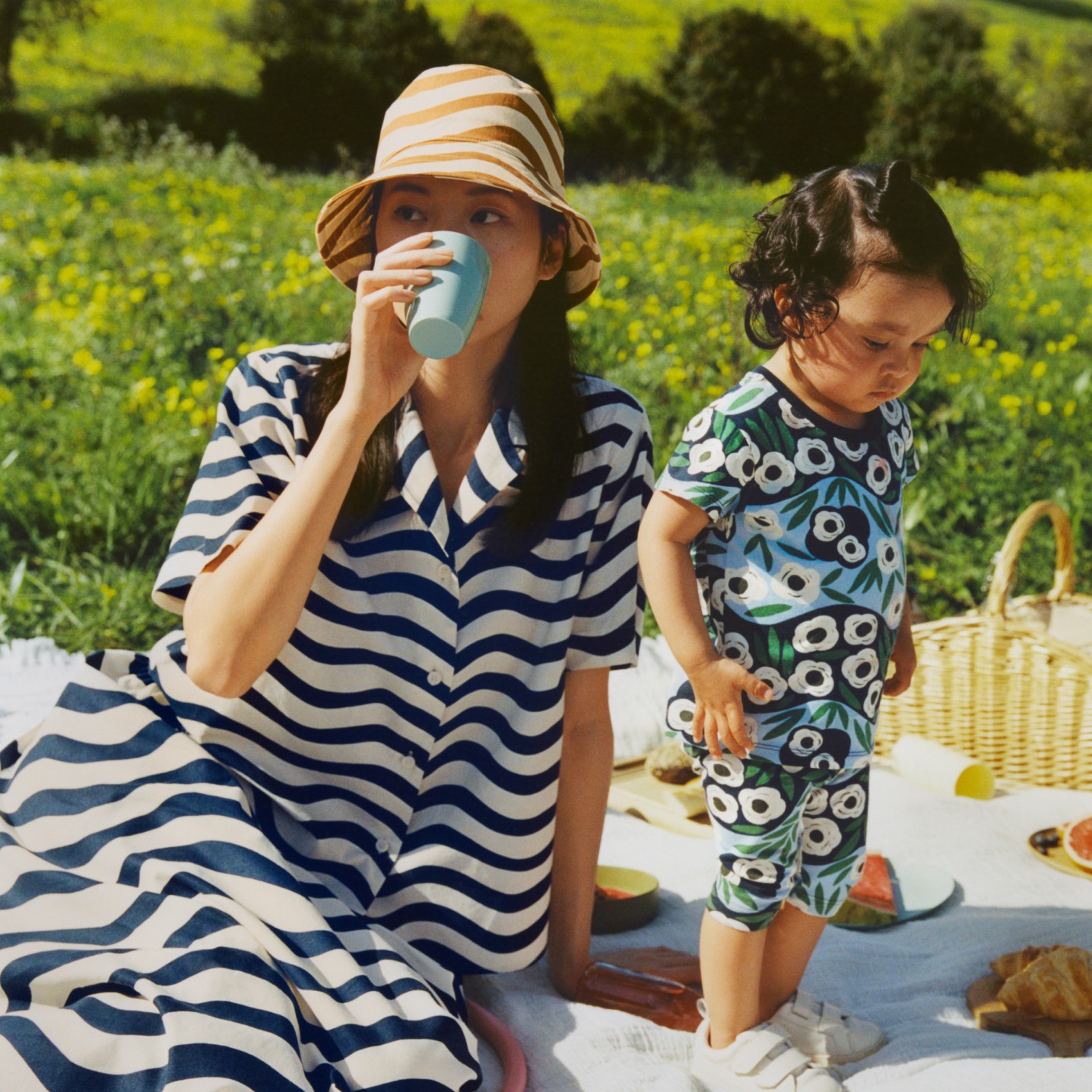 Women and child wearing Uniqlo and Marimekko collaboration clothing in piknik