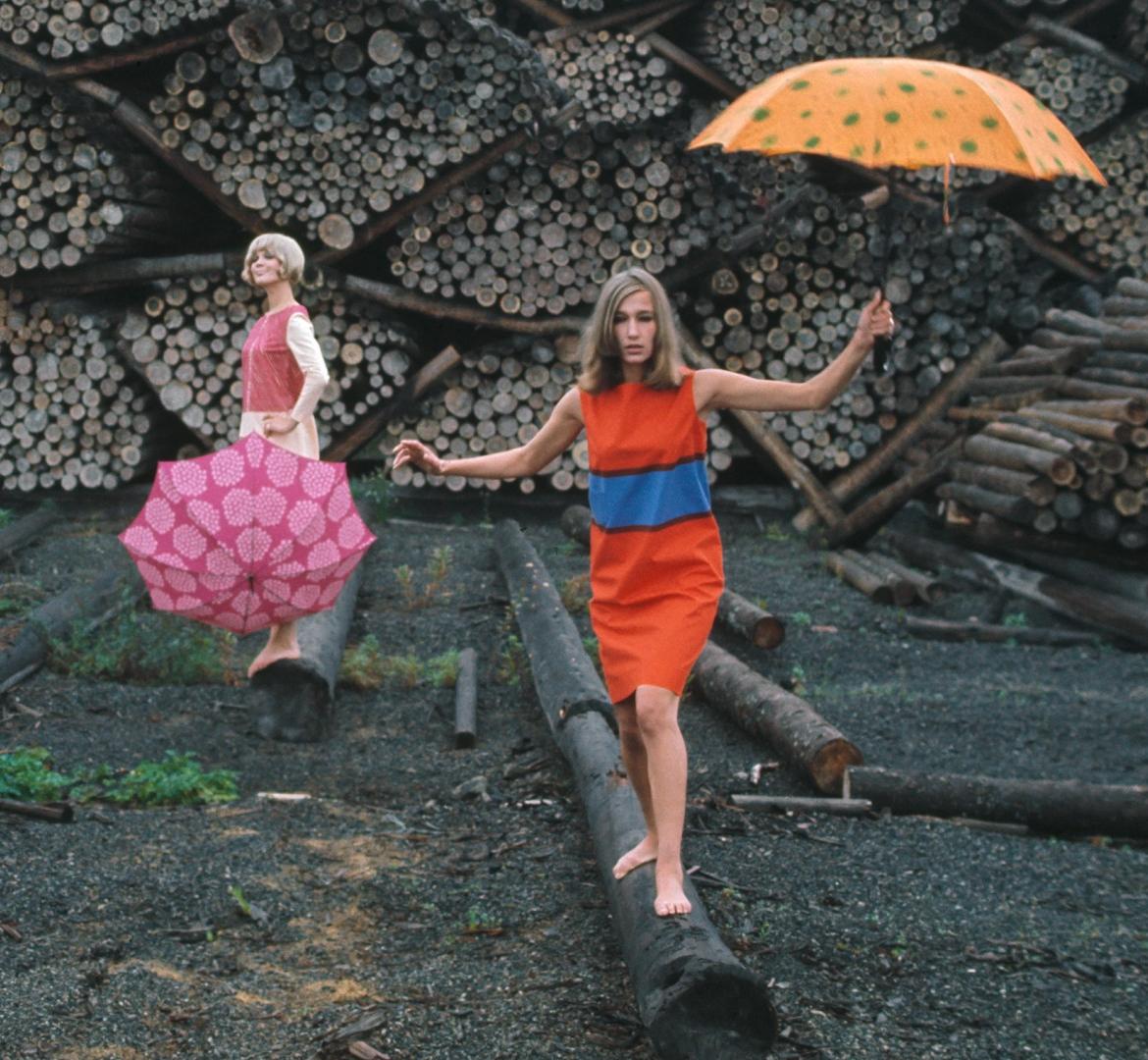 Models wearing vintage Marimekko Marimini dresses in the rain.
