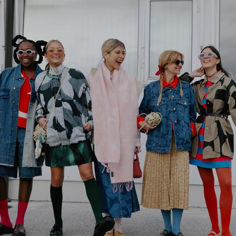 Influencers smiling and wearing Marimekko collection pieces in Copenhagen fashion week