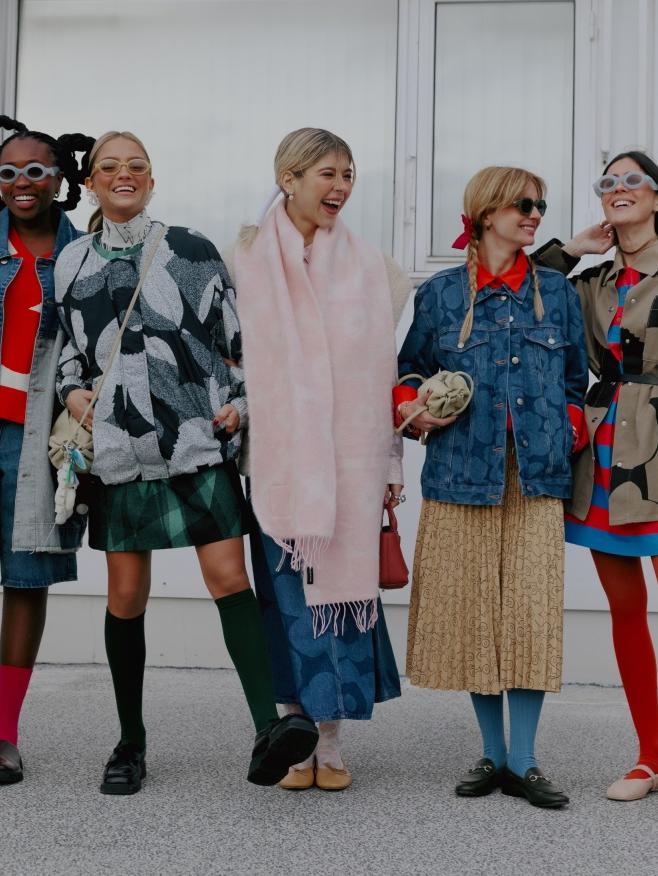 Influencers smiling and wearing Marimekko collection pieces in Copenhagen fashion week