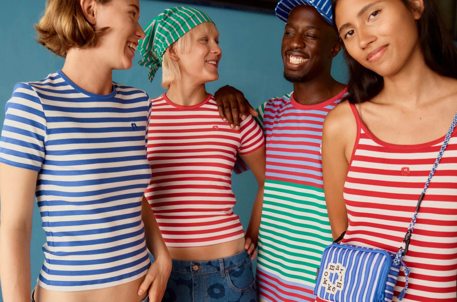 Models are wearing multicolored Tasaraita shirts and dress and Maridenim shorts and skirt.