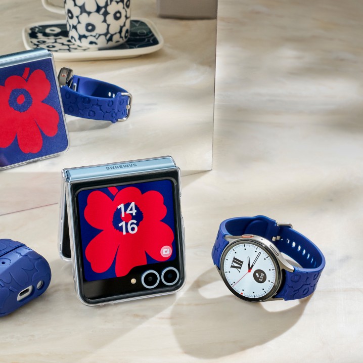 Samsung and Marimekko collaboration red and blue phone background in Unikko pattern, iPod cover in blue Unikko pattern and watch wrist in blue Unikko pattern
