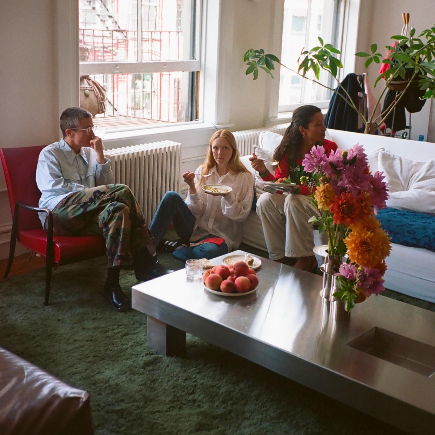Guests enjoying lunch in Laila Gohar's living room
