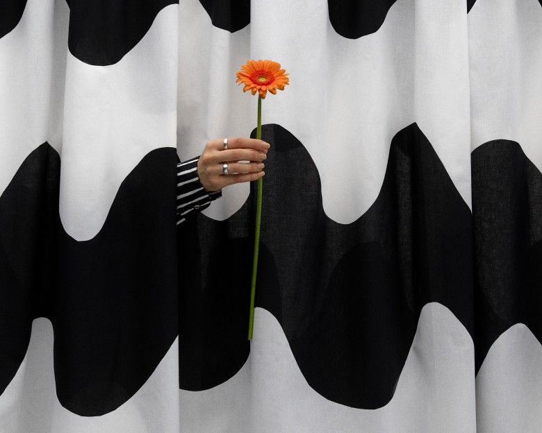 Picture of hand giving out a flower