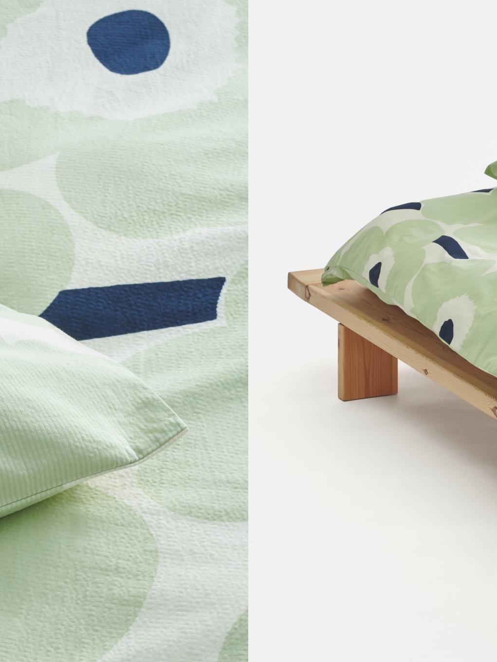 Light green sheets with Unikko print.