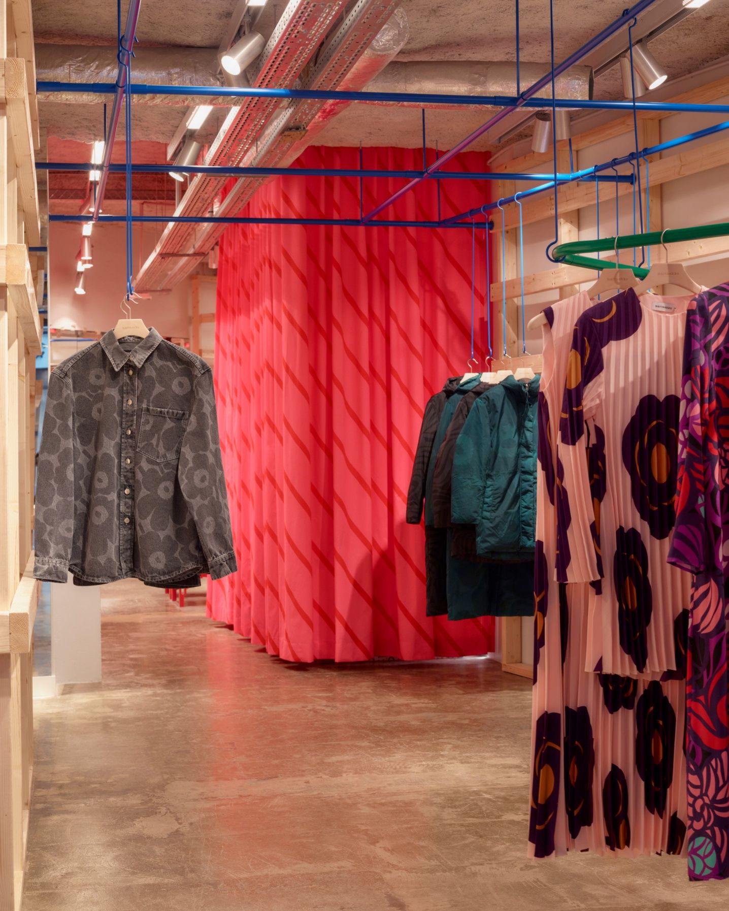 Display of Marimekko denim shirts and dresses.