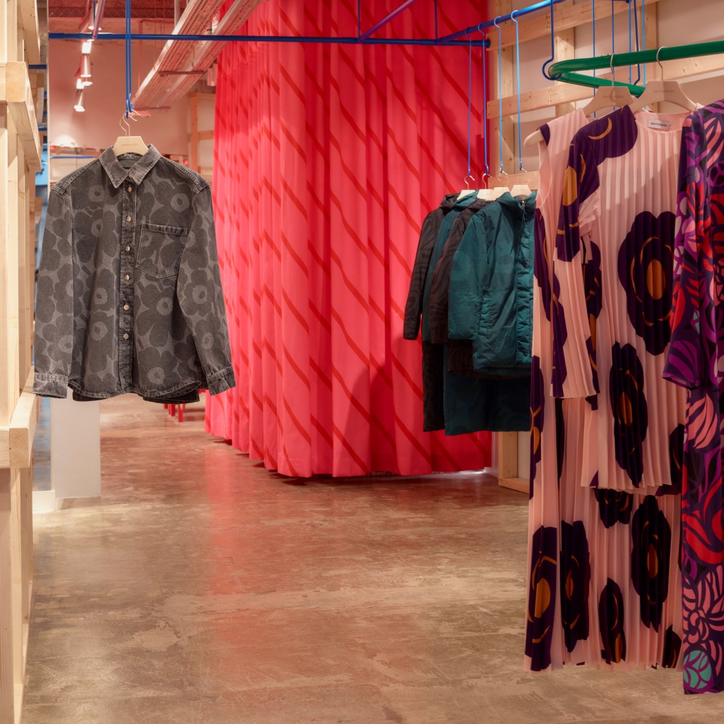 Display of Marimekko denim shirts and dresses.