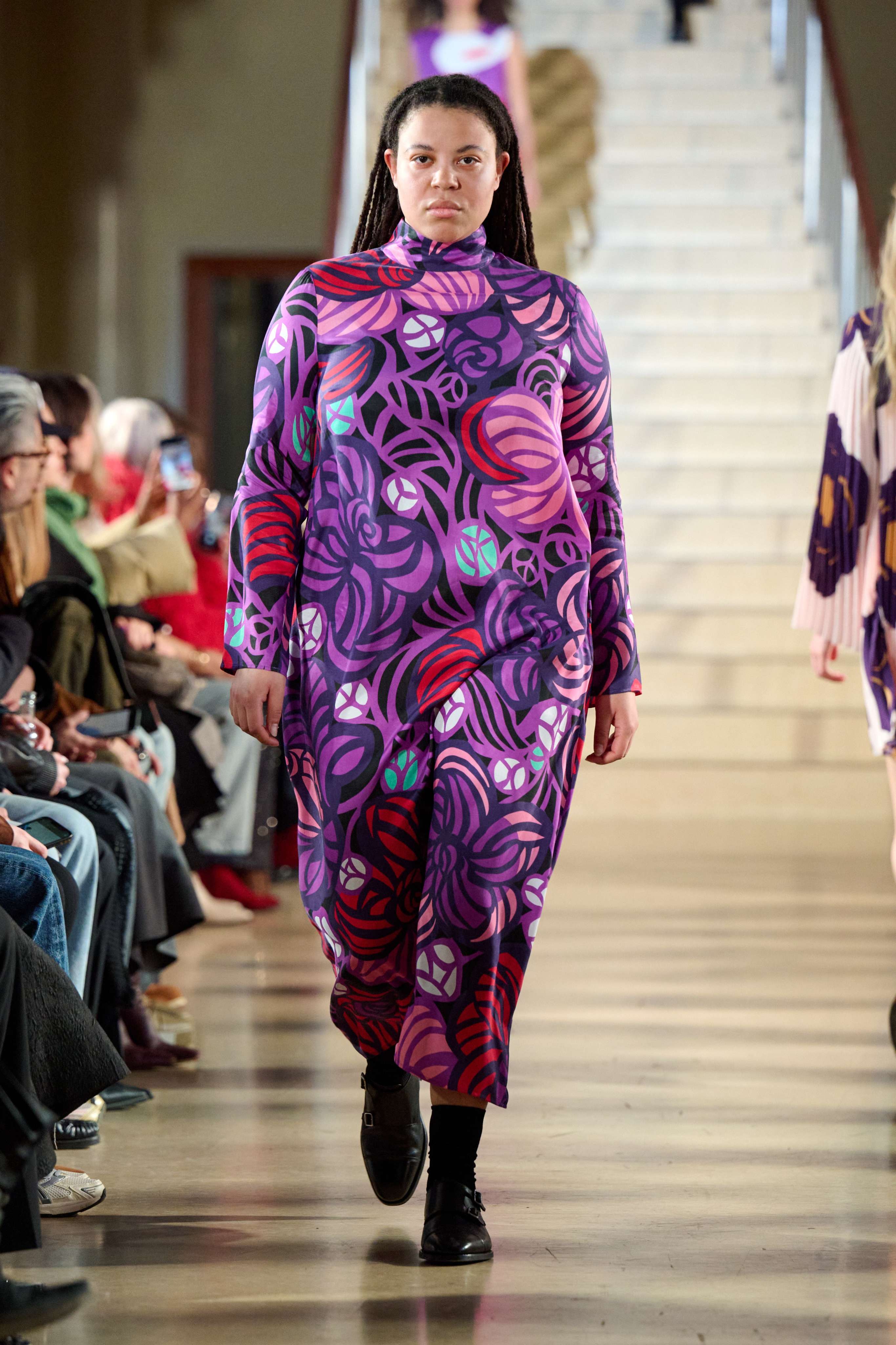 Model wearing a lilac dress in flower print.