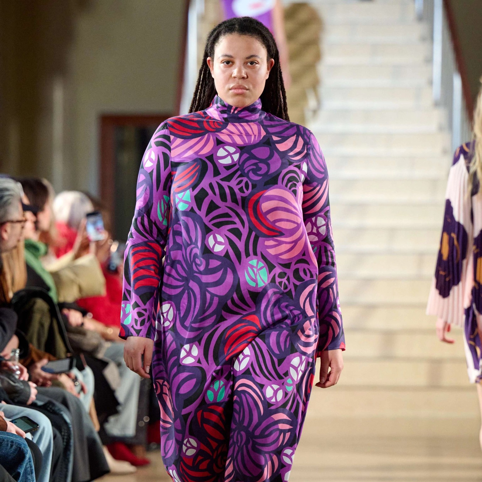 Model wearing a lilac dress in flower print.