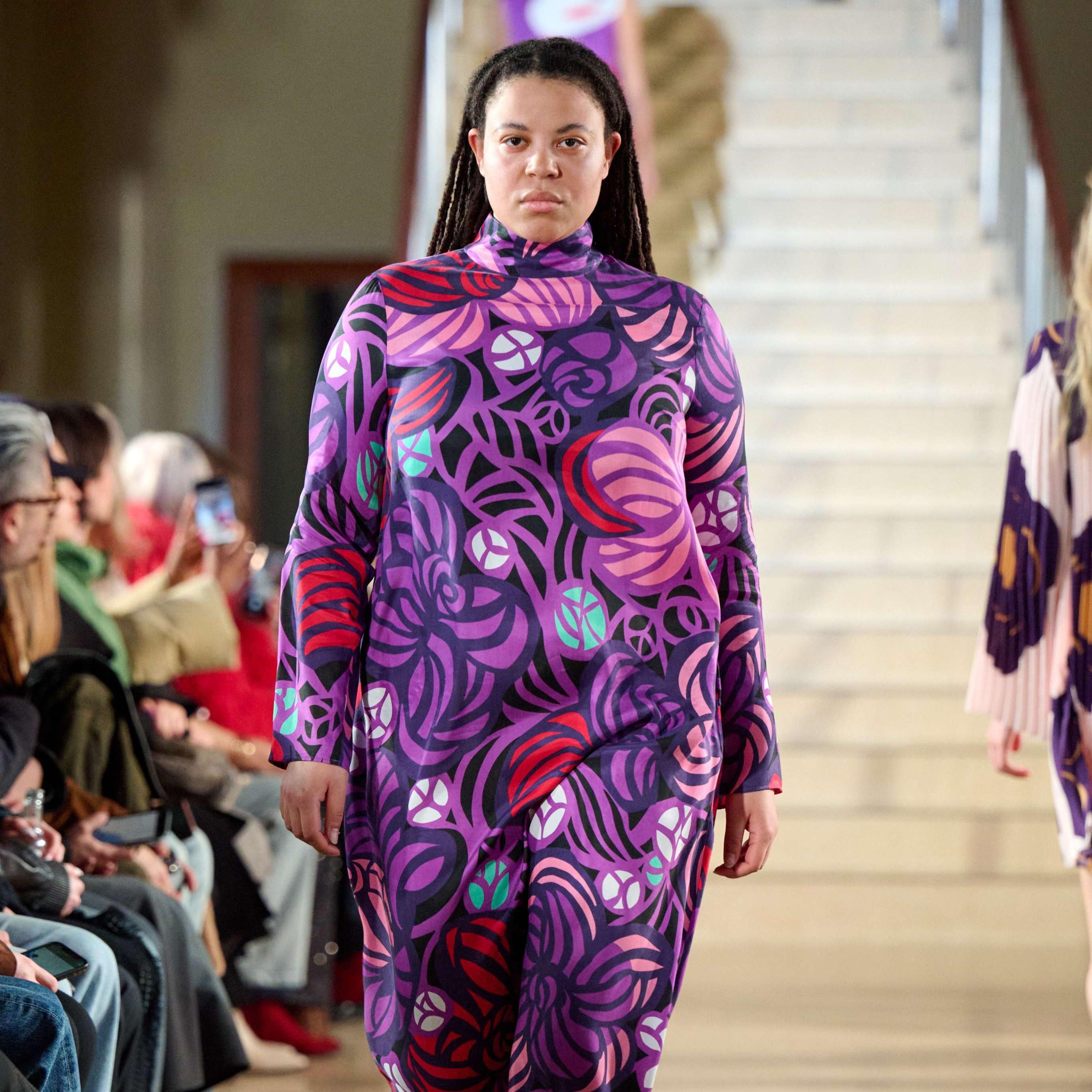 Model wearing a lilac dress in flower print.