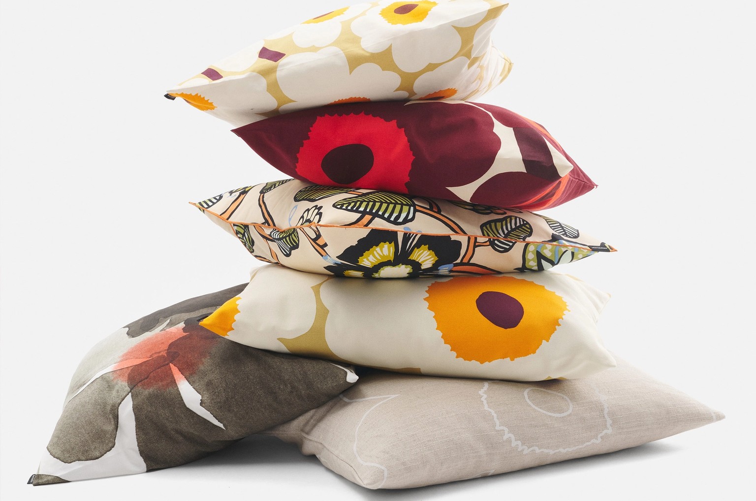 Stacked cushion covers in different prints.
