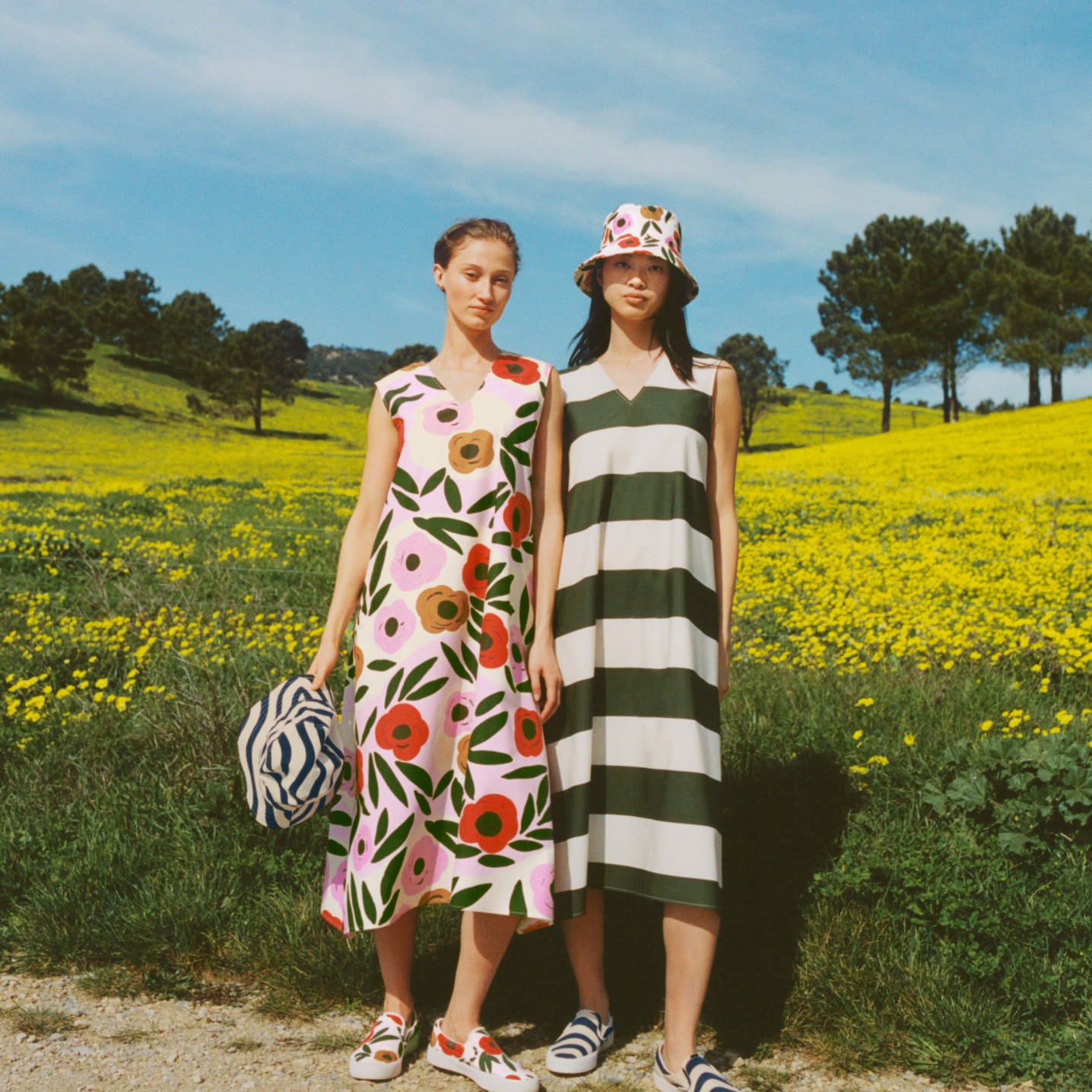 Models wearing colourful Uniqlo Marimekko summer dresses