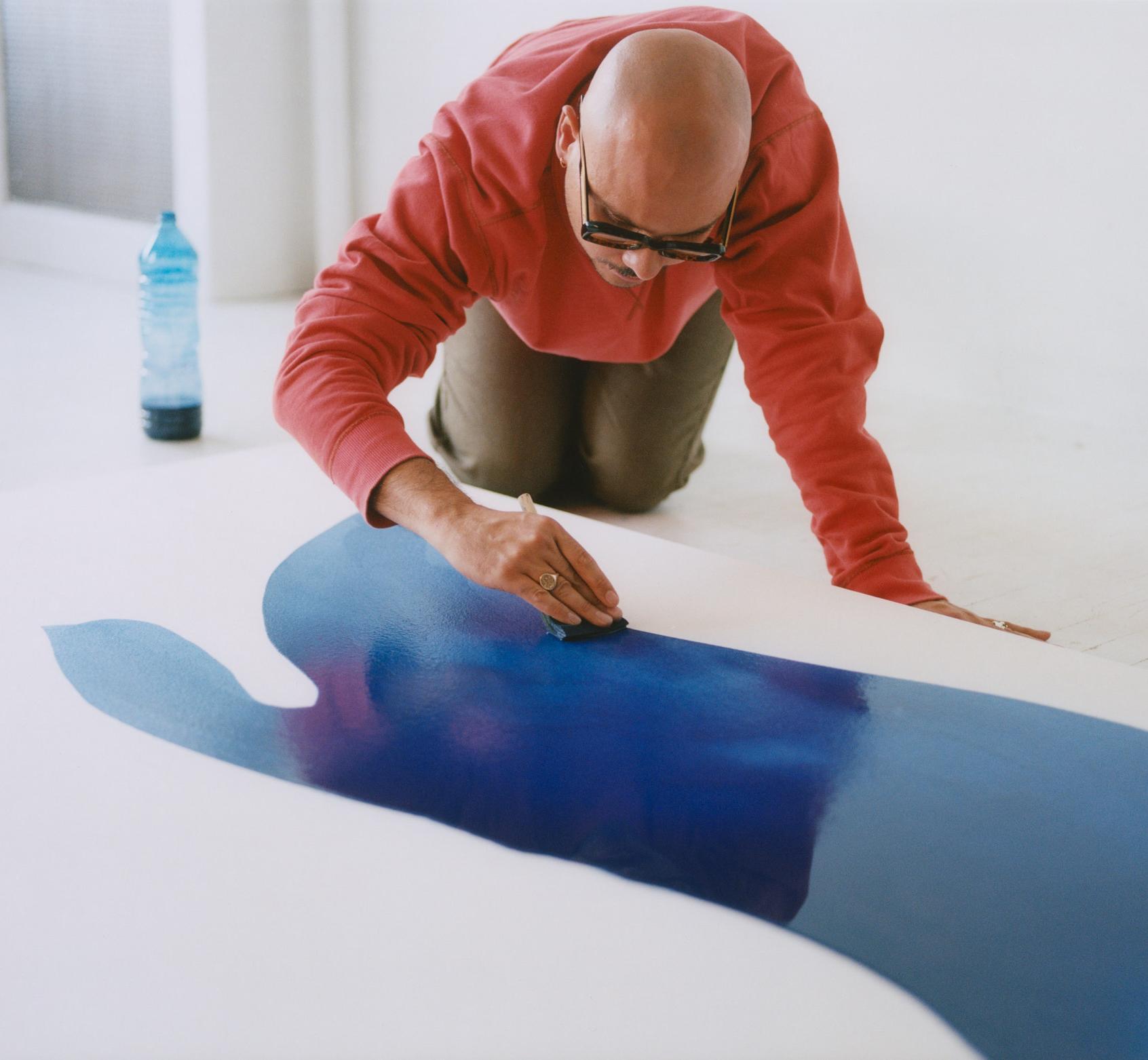 Landon Metz is painting.