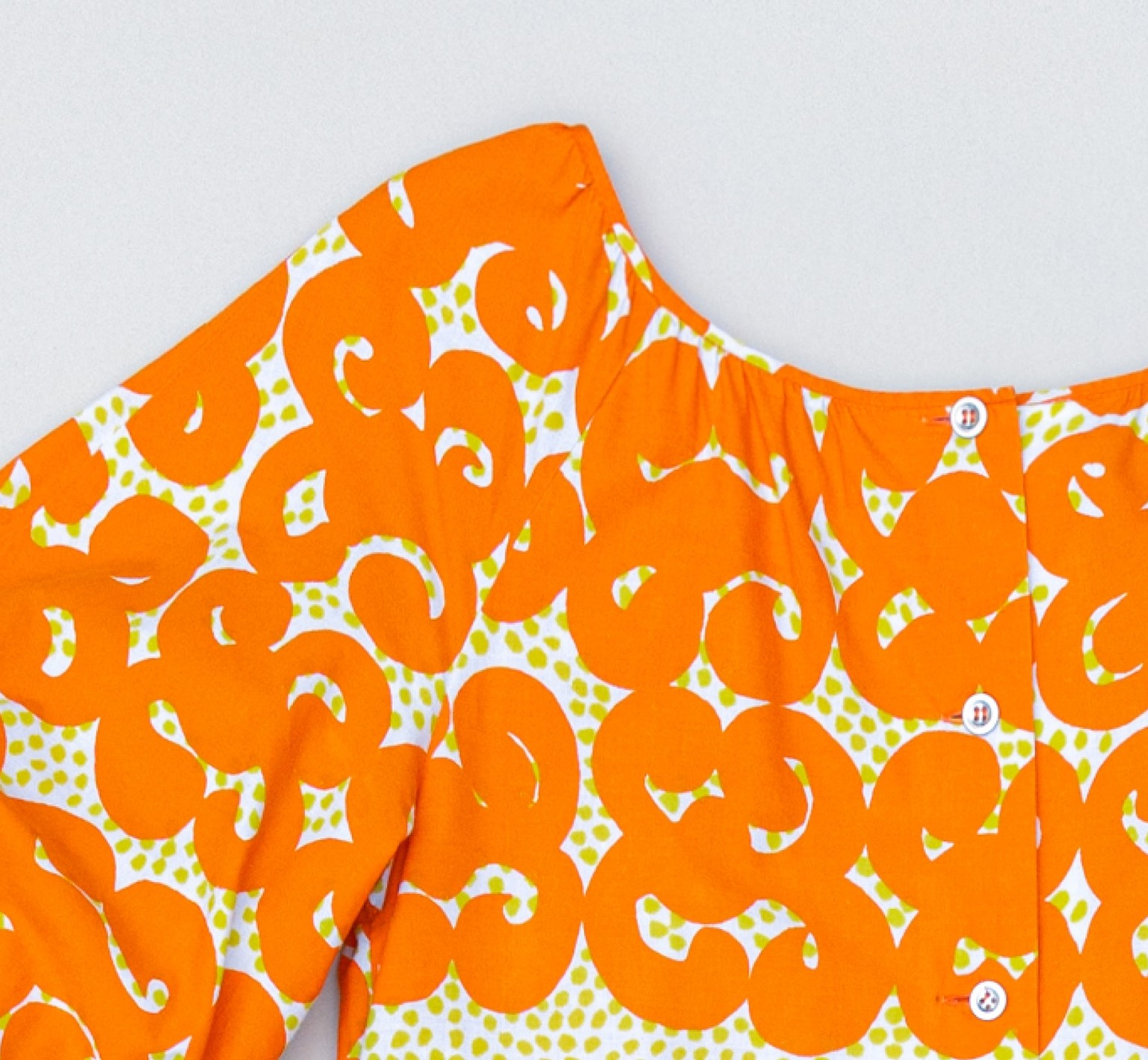 Vintage dress with orange Jokeri print.