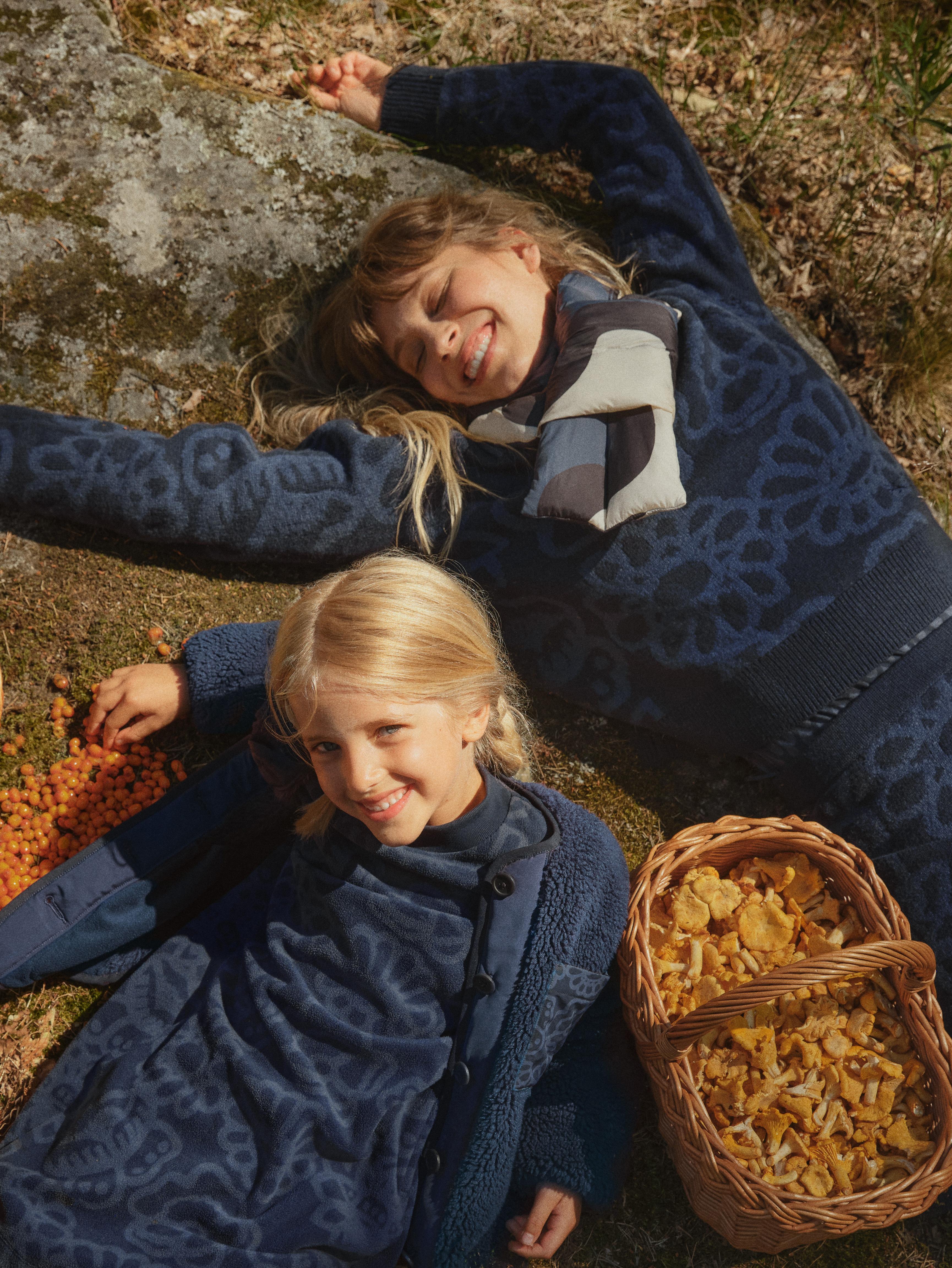 Models wearing UNIQLO x Marimekko collaboration items.