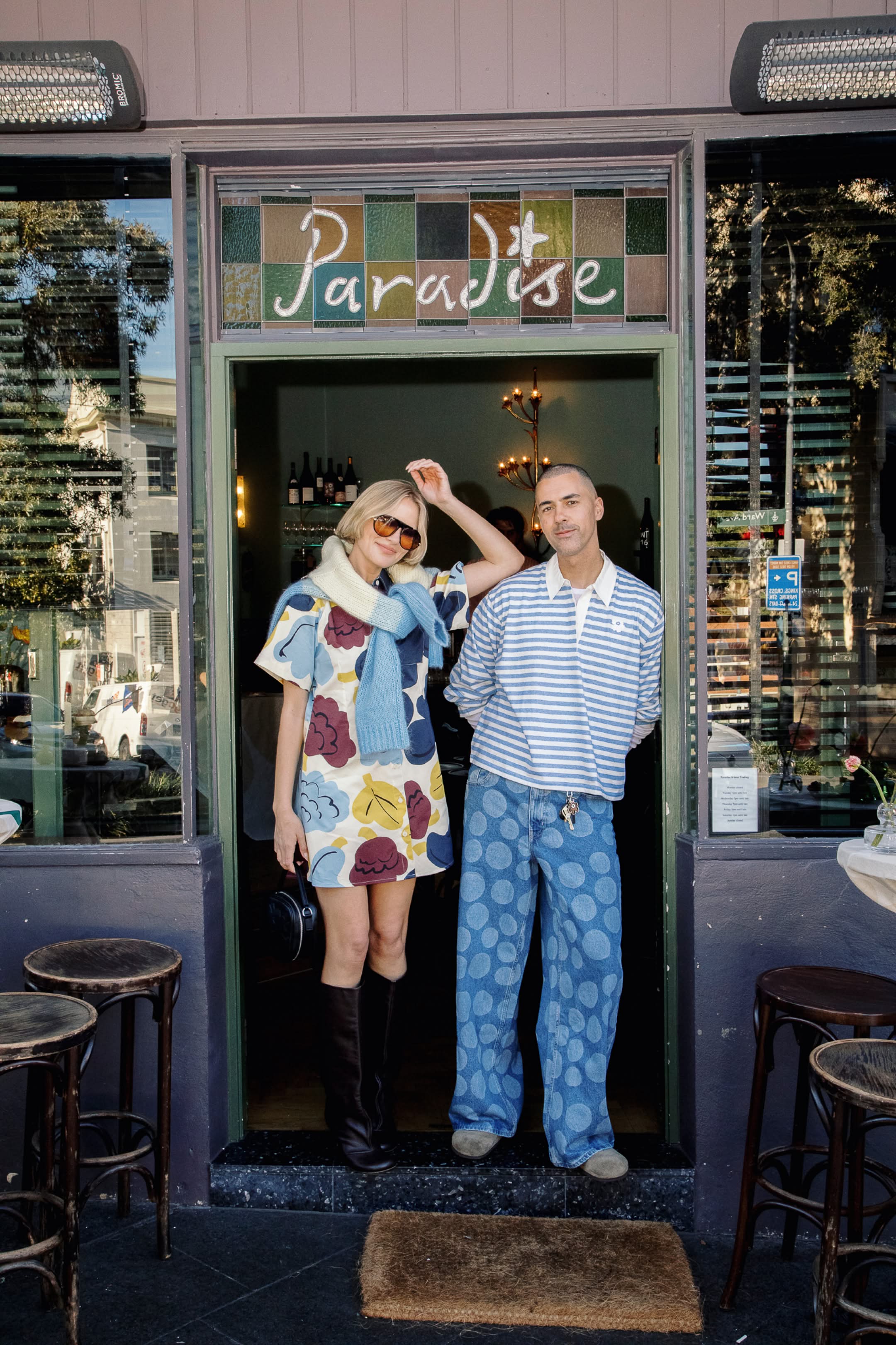 @mrturner wearing Kioski jersery top in blue and white stripe and @violetgrace wearing Seikkailu Kukasta Kukkaan dress in shades of blue burgundy and yellow white blue and yellow knit draped over shoulders
