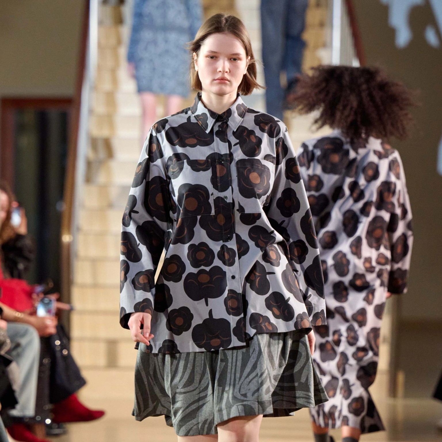 A model walking in Marimekko's fashion show