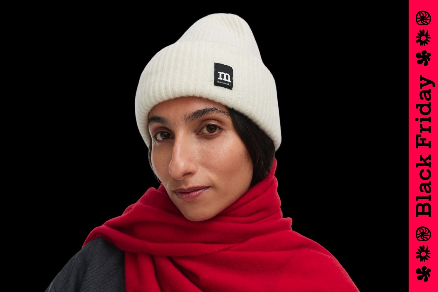 Mallilla on valkoinen pipo ja kuvan sivulla on Black Friday -teksti.