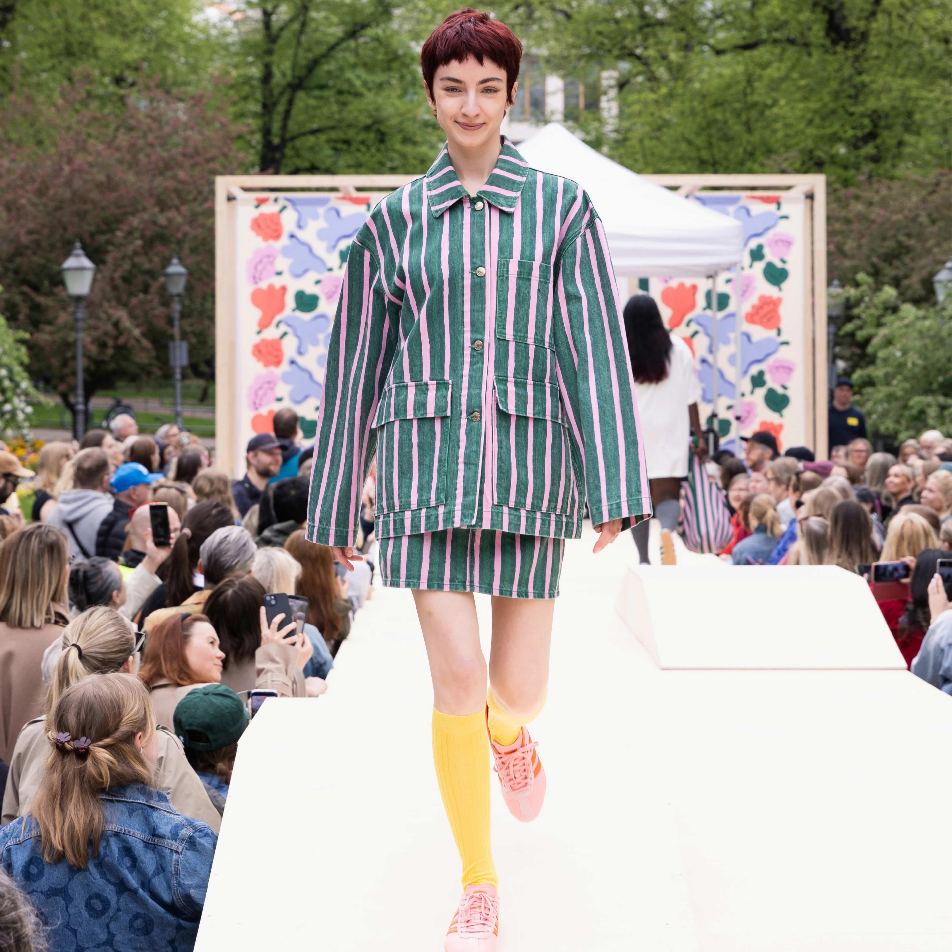 The Marimekko Day model walks on stage