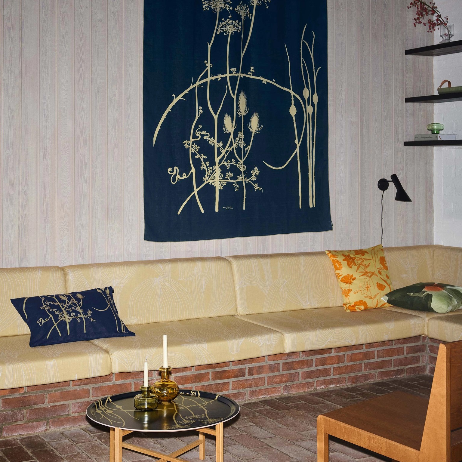 Art fabric in Vuoren kasvit hanging on the wall.