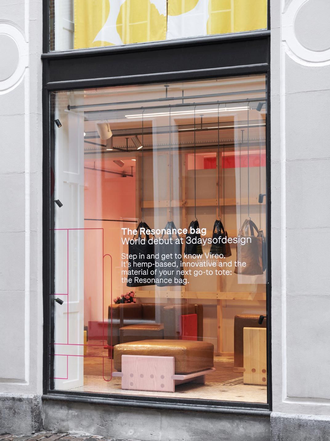 Window of a store in Copenhagen, with text about the Vireo material of the Resonance bag collection.