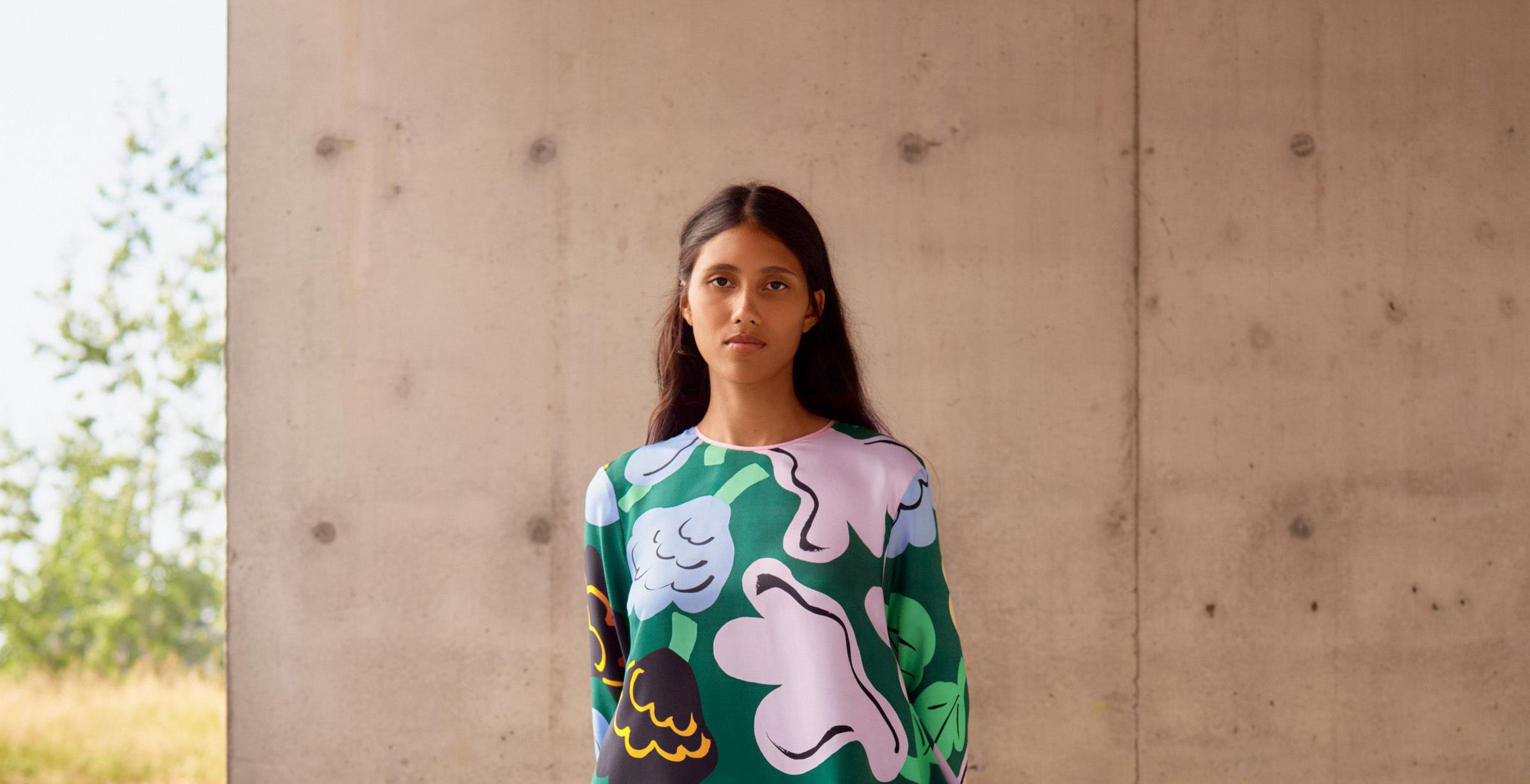 Model wearing Kaunista dress in Kukasta Kukkaan print.