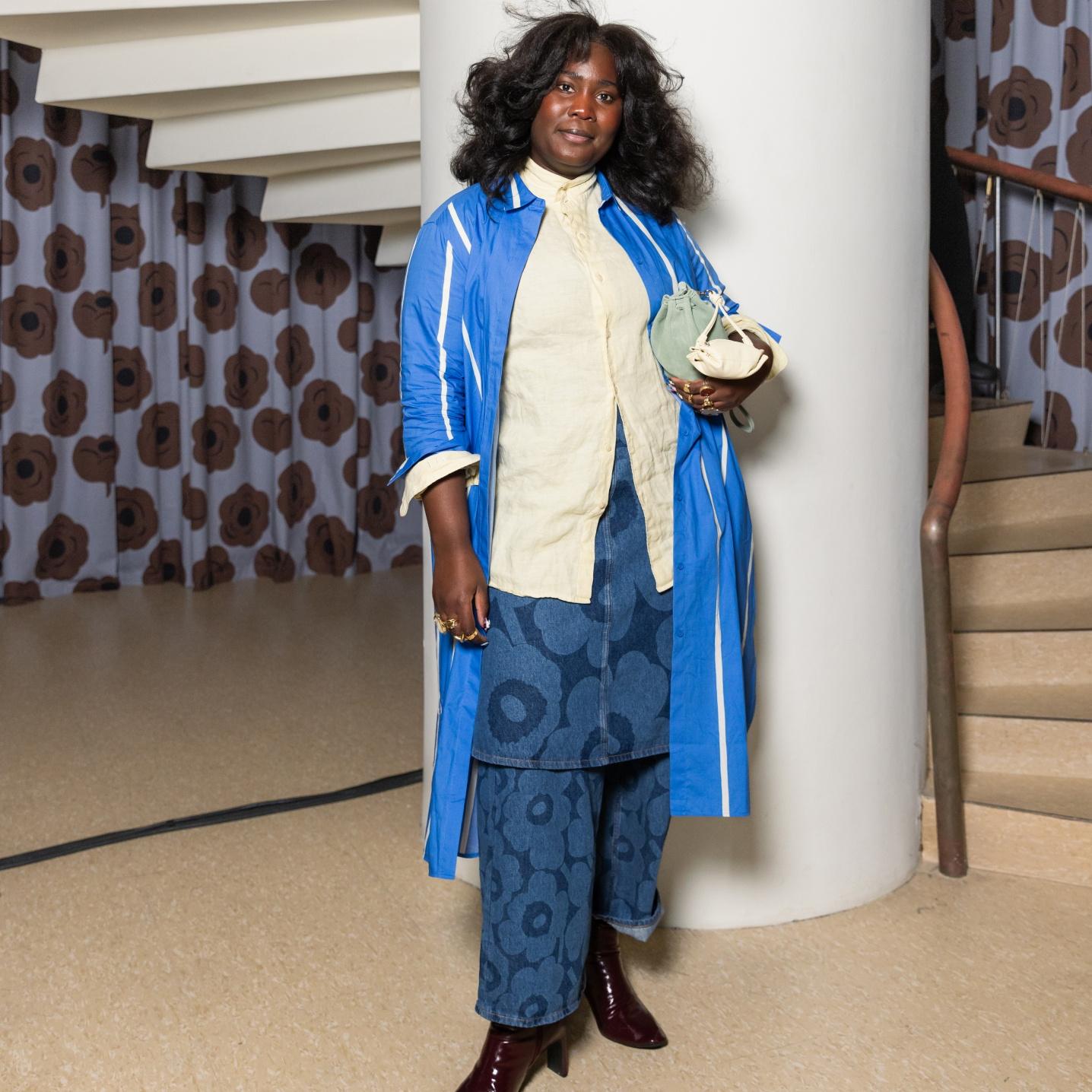 Luena Gama wearing blue and white outfit consisting of Maridenim trousers and skirt.