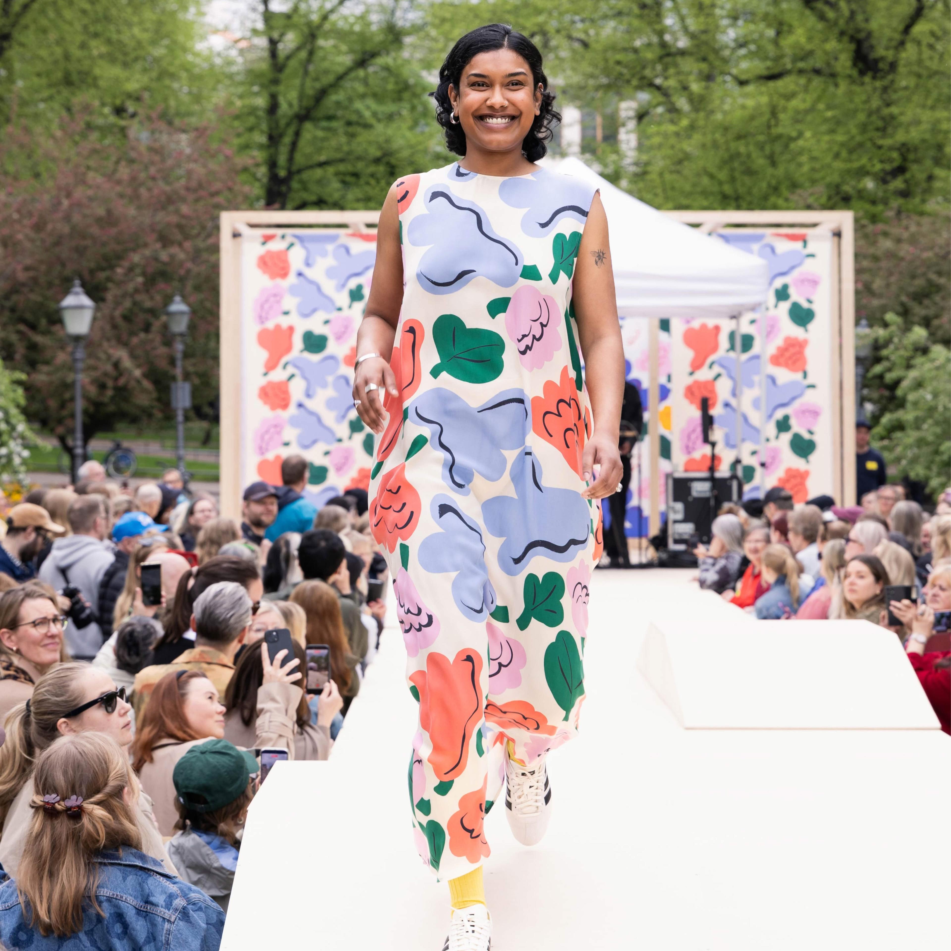 The Marimekko Day model walks on stage