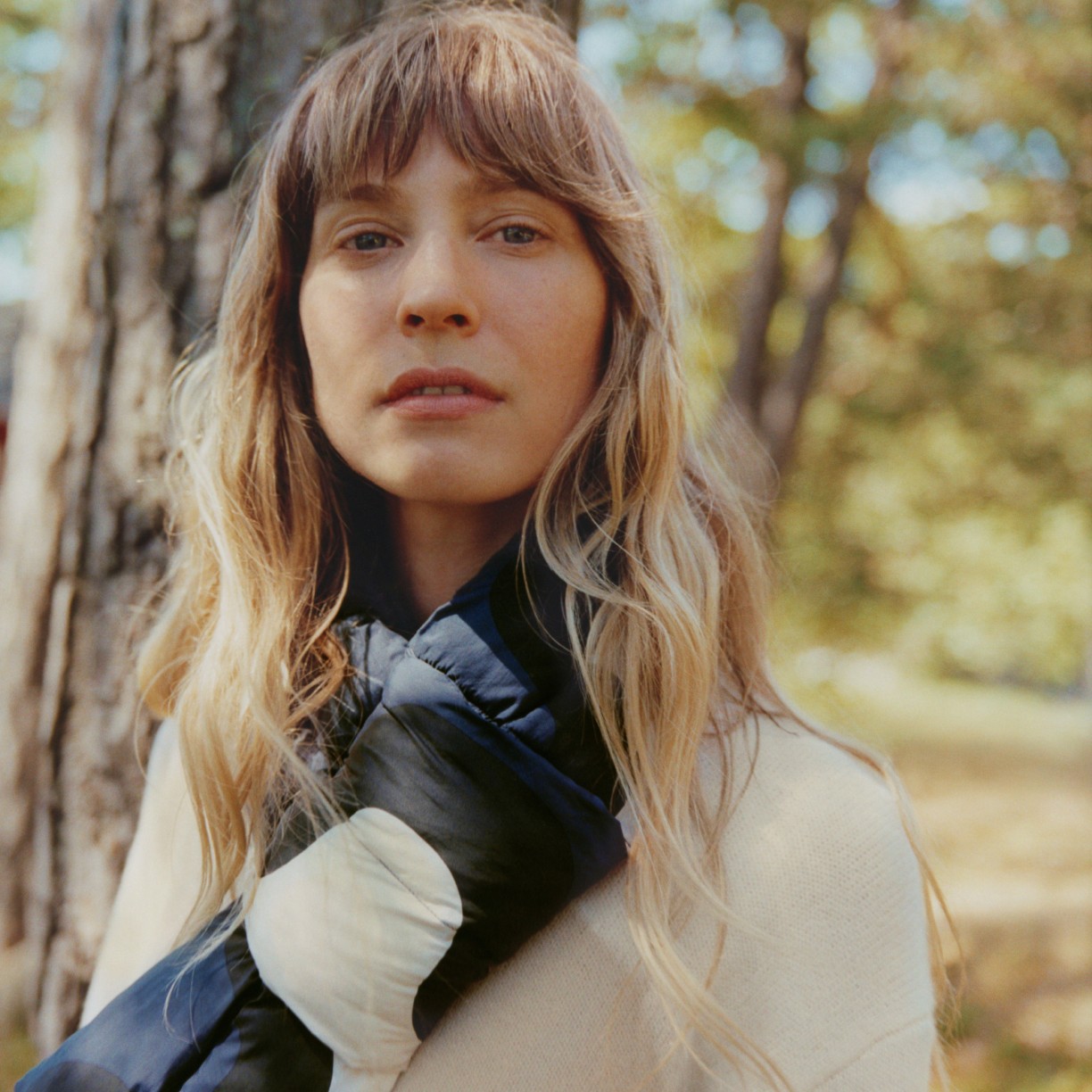 Model in the forest wearing Uniqlo and Marimekko collaboration clothing