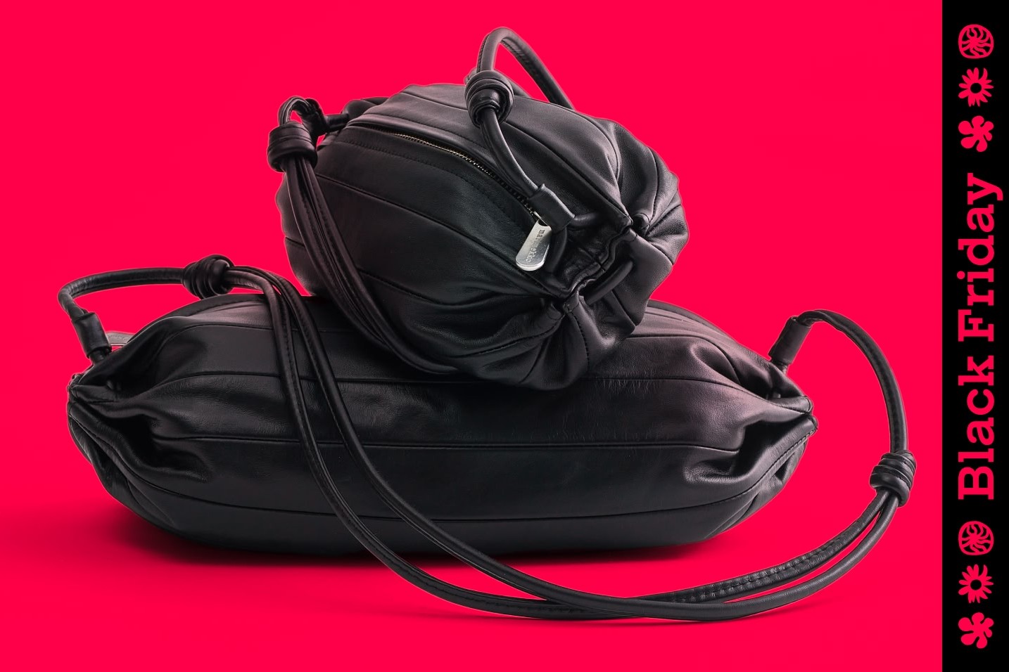 Two black Karla bag against a red background and Black Friday text on the side.