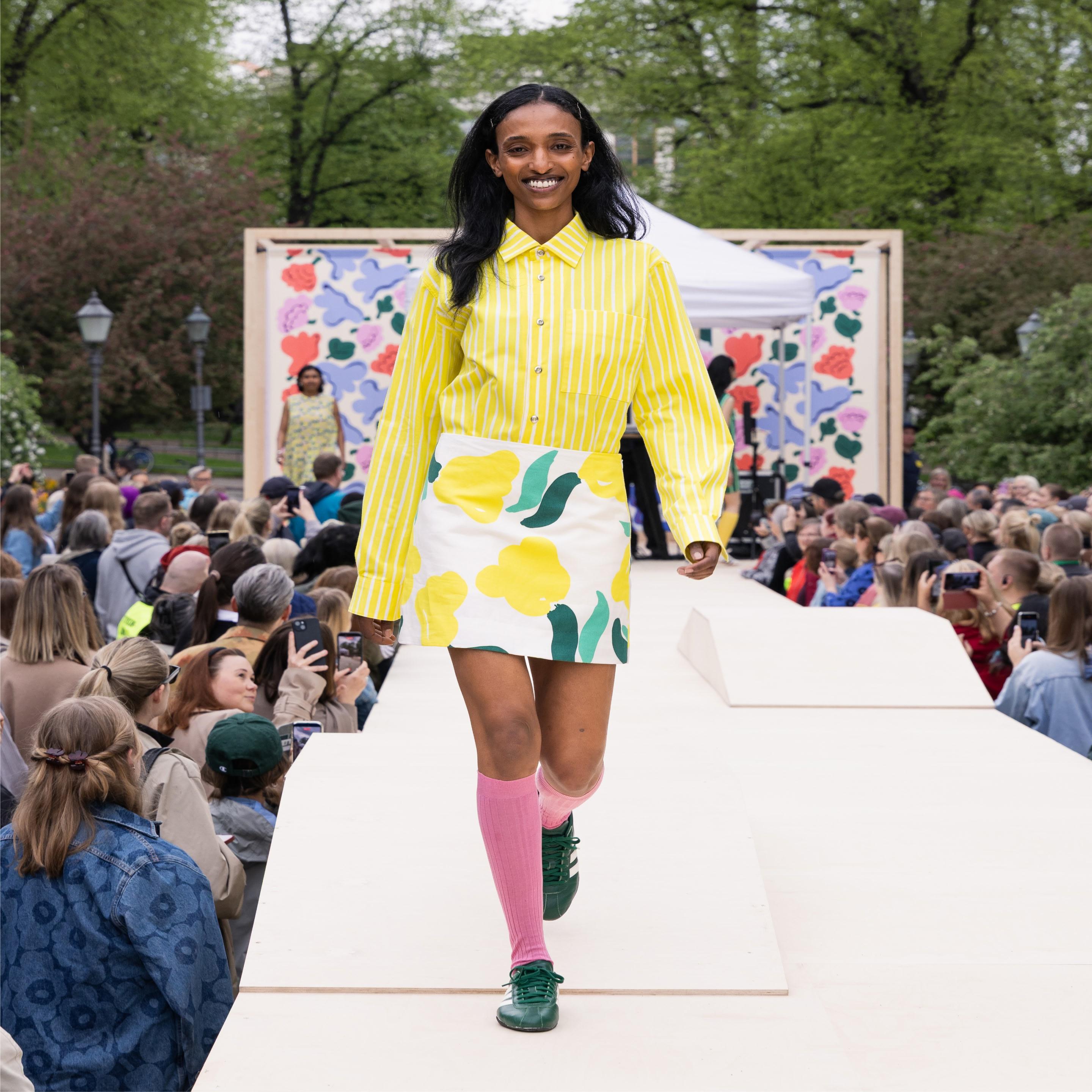 The Marimekko Day model walks on stage