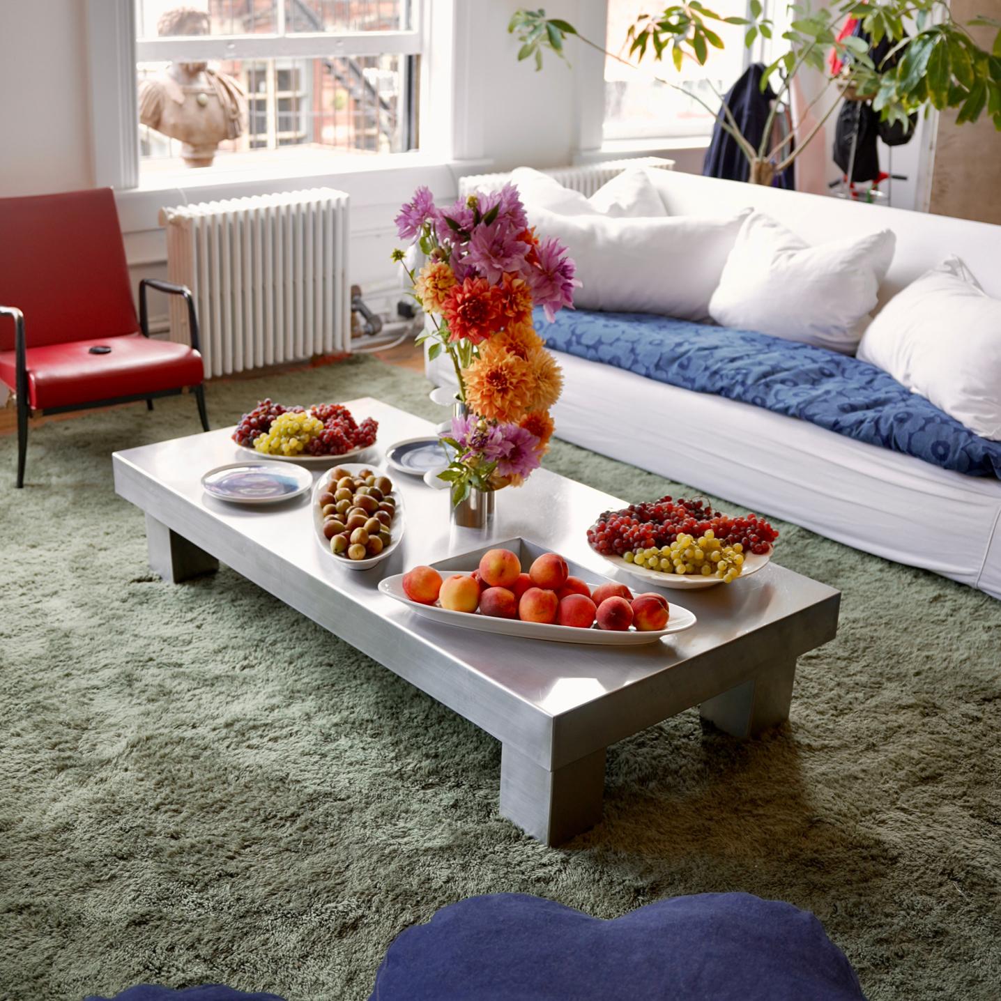 Fresh fruit on the silver table in Laila Gohar's living room, decorated with colorful flowers