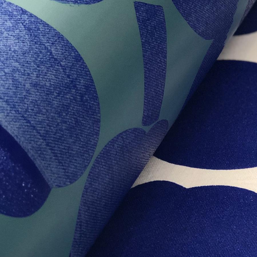 Printing machine printing blue and white Unikko pattern to fabric