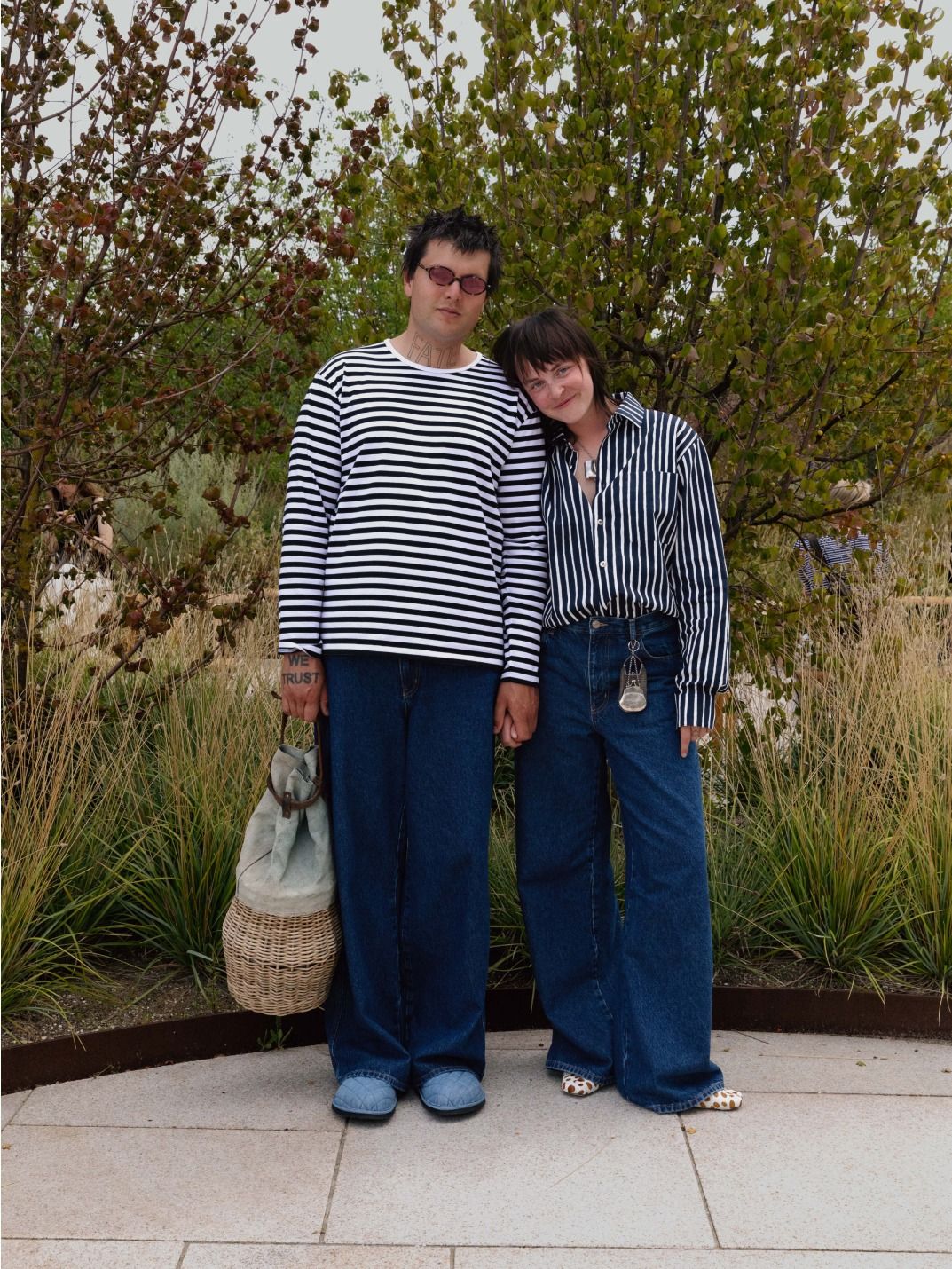 Sissi Pohle and Pat Scherzer wearing black and white Tasaraita and Jokapoika shirts and blue Maridenim jeans. 