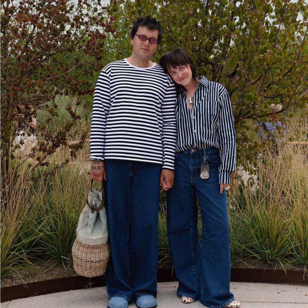 Sissi Pohle and Pat Scherzer wearing black and white Tasaraita and Jokapoika shirts and blue Maridenim jeans.