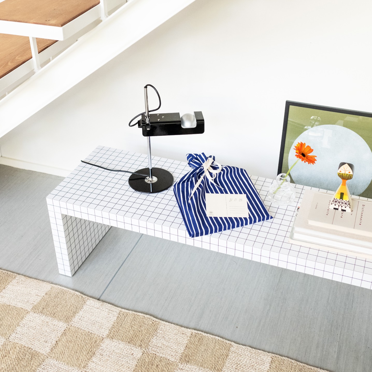 The gift is wrapped in a Marimekko fabric bag.