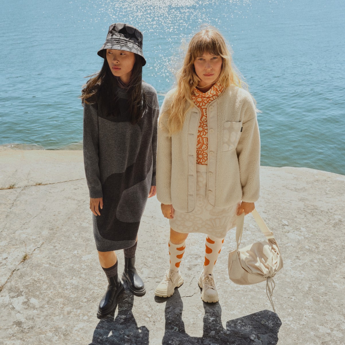 Models wearing Uniqlo and Marimekko collaboration clothing on the cliff