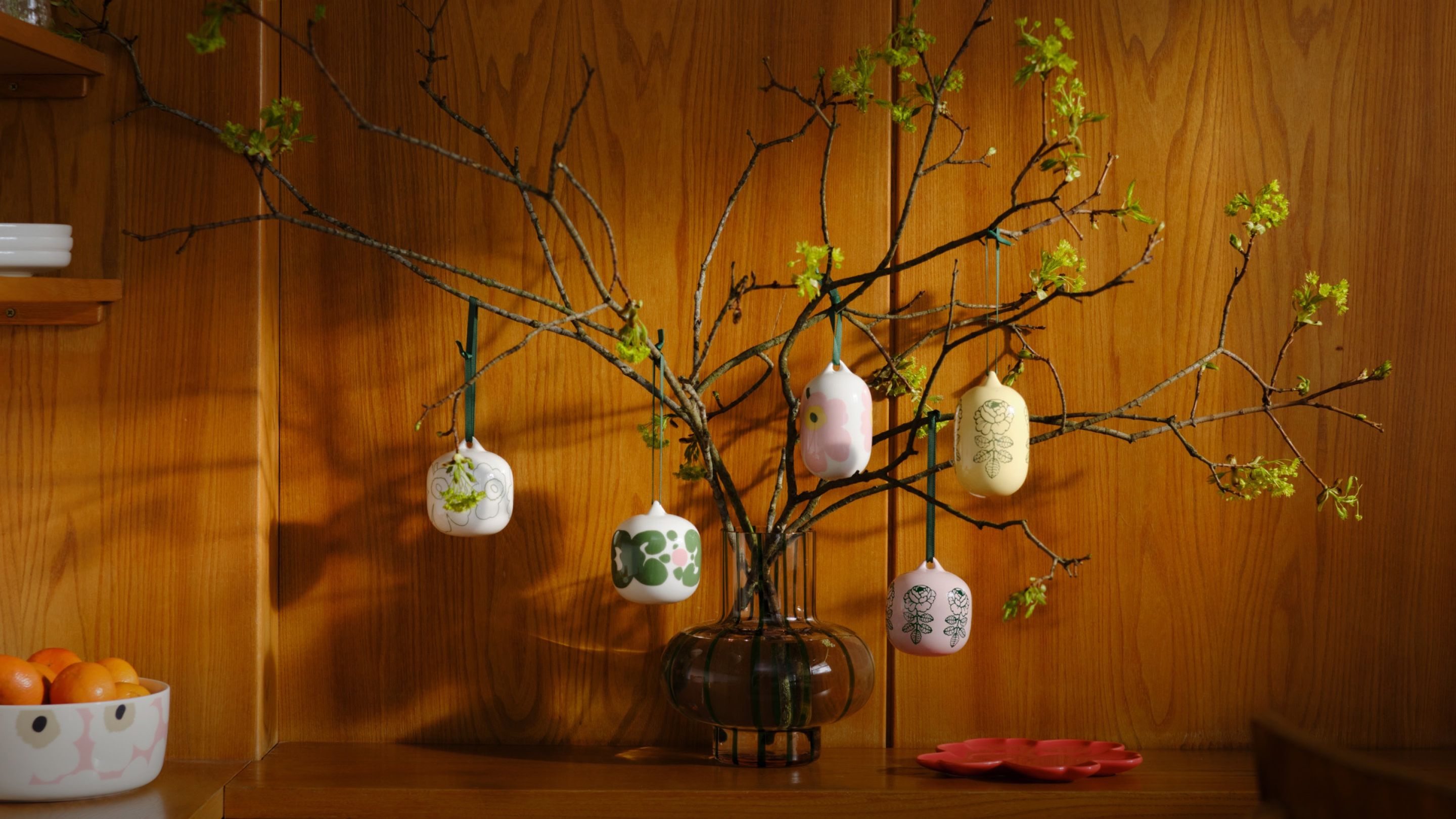 Ornaments on a branch with Vihkiruusu, Unikko and Keidas prints.