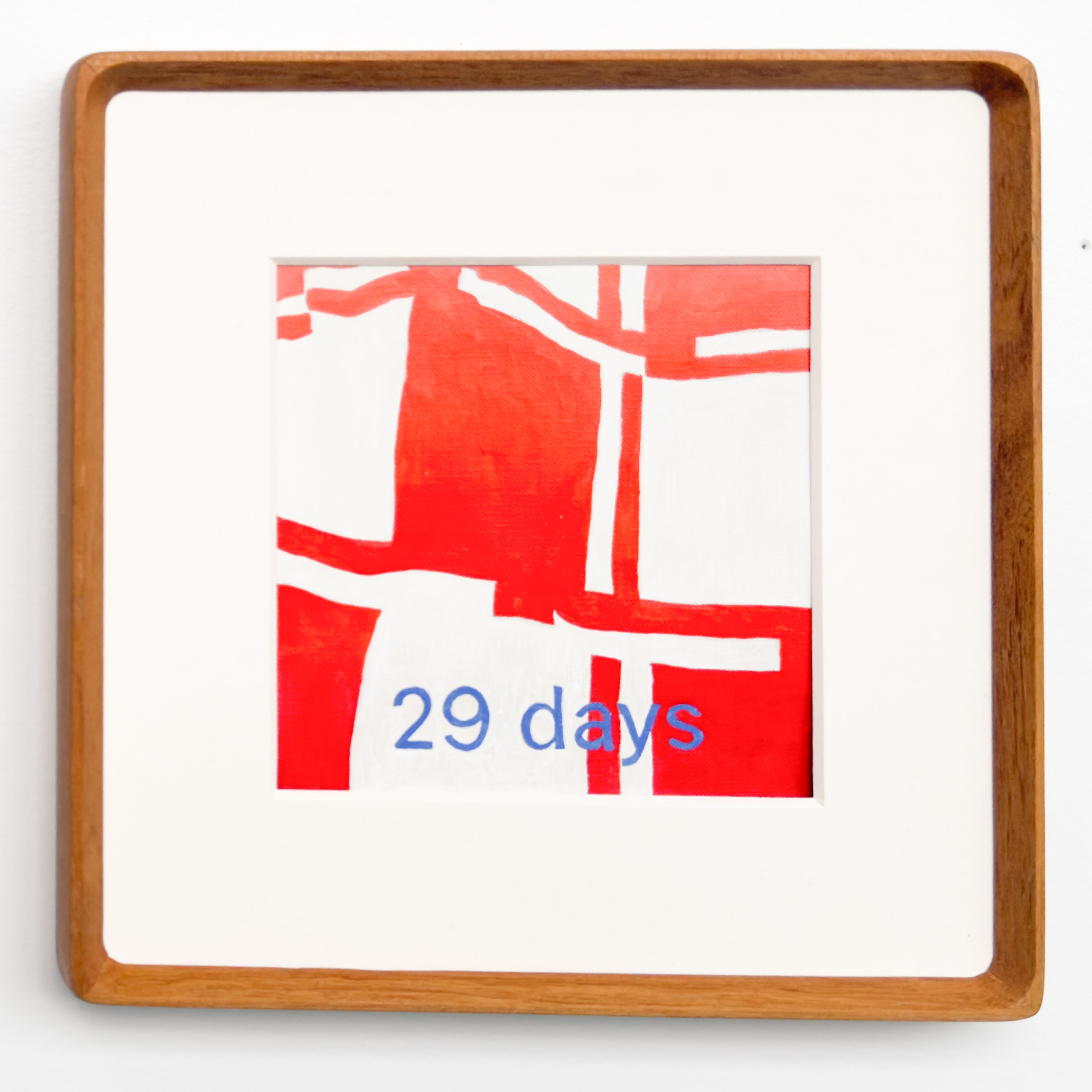 29 days - a six by six framed geometric painting with red and white quilt pattern and "29 days" overlayed in blue paint