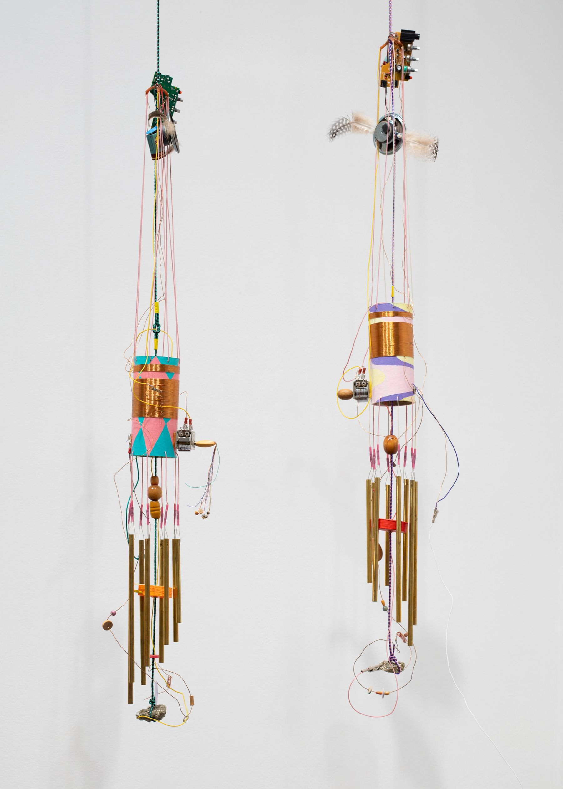 Peter Simensky, (left to right) wind chimes (pink + blue radio), 2021; wind chimes (pink, purple + yellow radio), 2021.