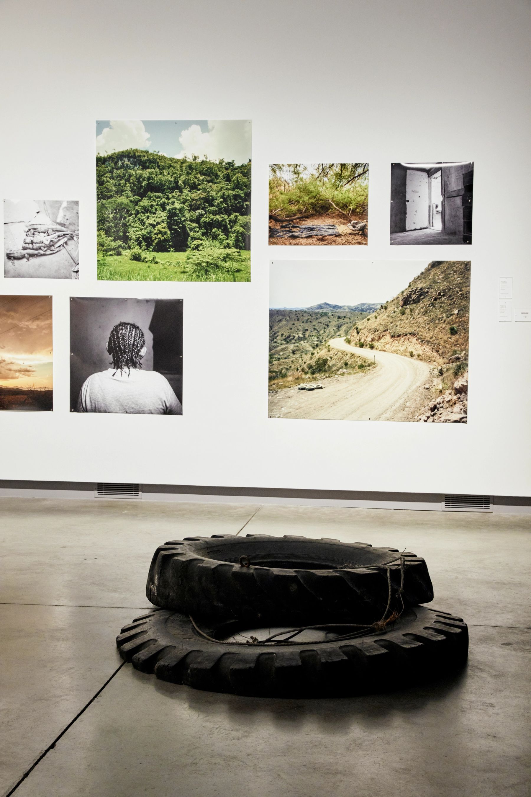 Making Migration Visible: Traces, Tracks & Pathways installation view with works by Jason De León, Michael Wells, and Lucy Cahill.