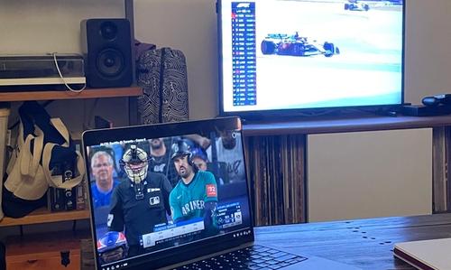 My partner watching F1 and baseball at the same time. Takes after his mom who does the same thing.